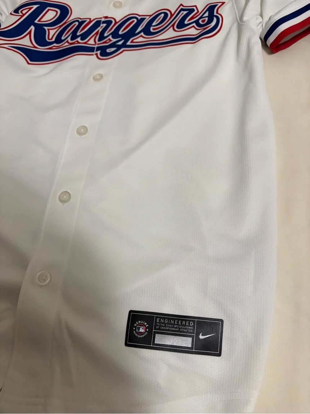Nike White Baseball Jersey with Blue Swoosh